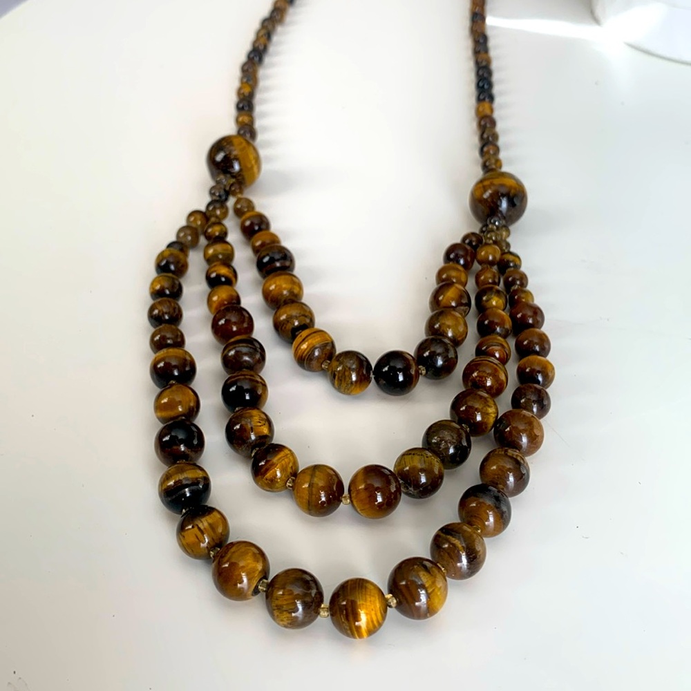 Tigereye necklace. 24in the smallest strand. 29 in the longest s. Silver closure
